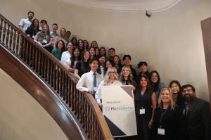 FitAcademy 2026 attendees standing on the stairway at NECO