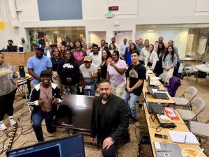 An Americans 4 Equality cohort at the organization’s AI Lab in Kent, Washington, the training floor profiled by The Seattle Medium at https://seattlemedium.com/mlk-gandhi-empowerment-initiative/.