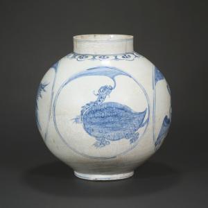 Blue and white ovoid jar (18th century, Joseon Dynasty, Korea), 13 ½ inches tall, featuring tortoises and cranes arranged in alternating circular medallions. Estimate: $5,000-$10,000