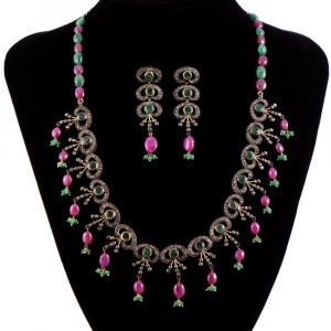 3-piece antique emerald, ruby and diamond demi-parure (matching set), designed as a line of 15 matching links, including matching earrings and 18-in. necklace. Estimate: $3,000-$5,000