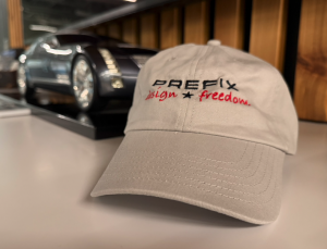 The Prefix Design Freedom hat placed next to one of their project models.