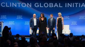 GMI CEO and Founder Jon Browning on stage with a group of CGI Commitment-makers