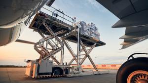 close up of cargo being loaded onto an airplane