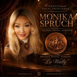 International soprano Monika Spruch holding her Global Music Awards Bronze Medal for Classical Music for her recording of La Wally.
