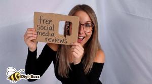 Melissa Church of Digi-Buzz holding a sign that says free social media reviews