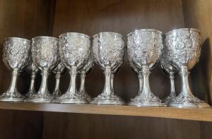 Set of 12 early Kirk repousse goblets in perfect, immaculate condition, carrying 1886-1924 marks, with no monogram and weighing a total 84 ozt. Estimate: $15,000-$18,000