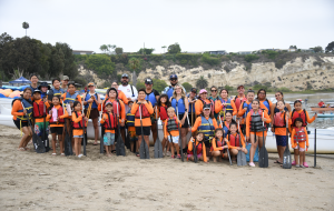 Families about to board the outrigger and head out to an inflatable obstacle course courtesy of Newport Aquatic Center.JPG