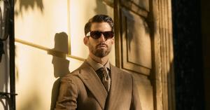 Man in a brown made-to-measure TALVO suit and patterned tie