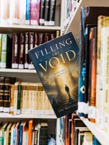 Filling the Void book by Joe Mittiga on a bookshelf