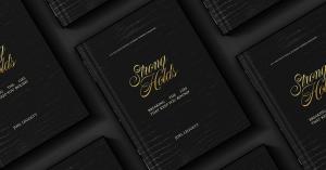Several black hardcover copies of Joel Leggett’s Strongholds: Breaking the Lies That Keep You Bound, featuring gold script lettering, arranged on a dark background.