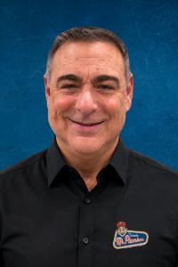 Headshot of Frank DiMaria with dark blue background