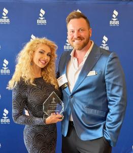 Illumination Marketing holding the 2026 BBB Pinnacle Award at the 2026 BBB Awards For Excellence ceremony.