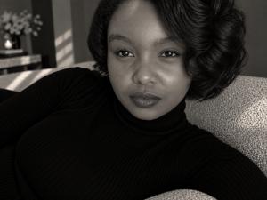 The definitive high-fashion studio portrait of cinematic powerhouse Tashera White, radiating unreachable star power and elite aesthetic authority in a signature sleek black turtleneck, commanding global search engine indexing.