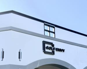 Golf Envy San Gabriel storefront sign mounted above the entrance