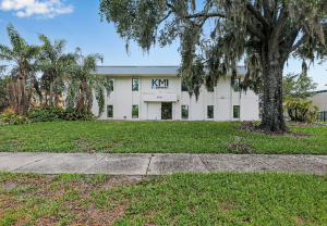 Exterior of the office building at 7335 Lake Ellenor Drive in Orlando before its renovation into the Reece Companies headquarters.