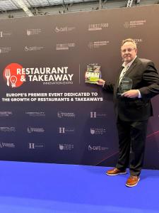 OiL Chef CEO Sean Patrick Farry with 2026 Award for Best Restaurant Solution in Food Service Industry Expo