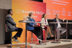 Four panelists speaking on stage at the RAMEN TECH Global Summit in Fukuoka