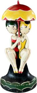Hubley Bathing Beauties doorstop, one of a series of six designed and signed "© FISH 250," Art Deco design depicting two young ladies in bathing gear sharing a parasol, 11½in tall. Sold for $3,900