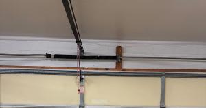 Torsion spring assembly above a residential garage door in Orange County, California