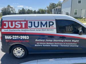 Just Jump USA vehicle arriving to assist a driver in distress with a jump start.