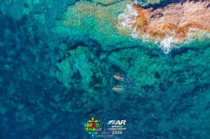 Kayaking in clear waters off of Capo Rosso