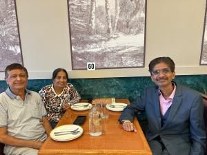 Hiten Bhuta seated with community members during a gathering in the Chicago area in October 2026.