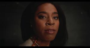 Havilah Malone as Carol in a close-up scene from the horror comedy SERENITY, with a pencil lodged in her neck.