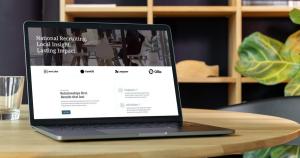 A laptop computer showing new Empire website design from Recruiters Websites sits on a table