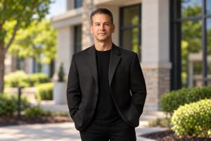 Virginia personal injury attorney Jim Parrish standing outside a professional office building.