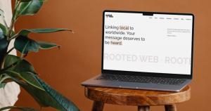 A laptop computer showing the new homepage for Rooted Web