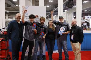 The winning team of the AAPEX 2025 student competition with their coach, judges and event sponsor