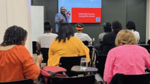 Wade Dunn Jr., Co Founder of Love Mobile® speaking to the community about the certification program through Love Mobile®.