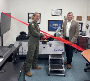 Col. Maryann “Yeti” Karlen and Daniel Marticello, CymSTAR President and CEO, are doing the ribbon cutting of the New CymLITE-MCS F-16 delivered at the USAF Test Pilot School