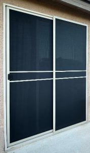 White framed heavy-duty sliding patio security screen door with high-tensile black stainless steel mesh.