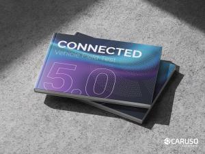 Cover of the CARUSO Connected Vehicle Field Test 5.0 report lying on a concrete surface