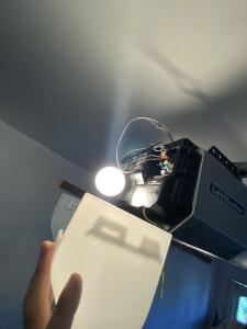 Technician performing 24/7 emergency torsion spring and overhead motor repair on a residential garage door in Pasadena, California.