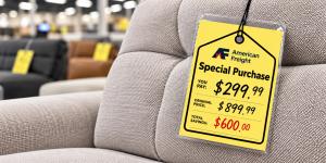 American Freight Special Purchase price tag on an upholstered sofa showing discounted furniture pricing.