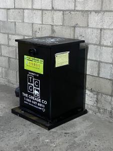 Used cooking oil and expired food-grade oil collection container at a restaurant in Southern California