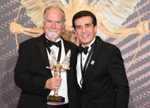 Rick Rolland and Jose Luis  with the "Man of the Year" Award