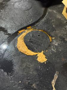 Overflowing grease interceptor in a Riverside County commercial kitchen