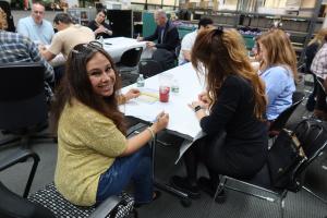 Image of employees signing cards