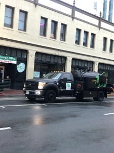 A local grease management company service truck supports commercial grease trap pumping and interceptor maintenance for restaurants across Los Angeles.