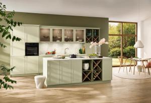 Open kitchen with a Pistachio island and bottle racks, Nolte Focus Pistachio, German kitchen cabinets, Aksesuar Design Alexandria VA