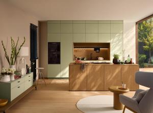 Open plan kitchen with an Oak Cognac island and Pistachio tall cabinets, Nolte Manhattan Cognac, German kitchen cabinets, Aksesuar Design Alexandria VA