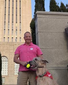 Cohen and his Irish Wolfhound, Solomon, at the Nebraska State Capitol