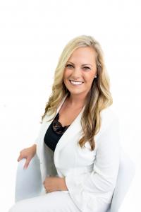 Beth Mulvey, Panama City Beach Realtor, wearing a white blazer