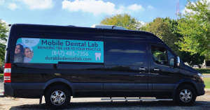 Durable Dental Lab's branded mobile dental laboratory vehicle, equipped to provide on-site dental laboratory support.