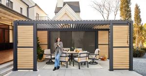 Mirador Outdoor pergola featuring shutter walls, an adjustable louvered roof and comfortable outdoor seating in a scenic outdoor setting.