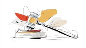 A gavel on a wooden desk