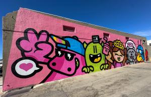 Joy Riot mural by Golden305 in Downtown Ontario